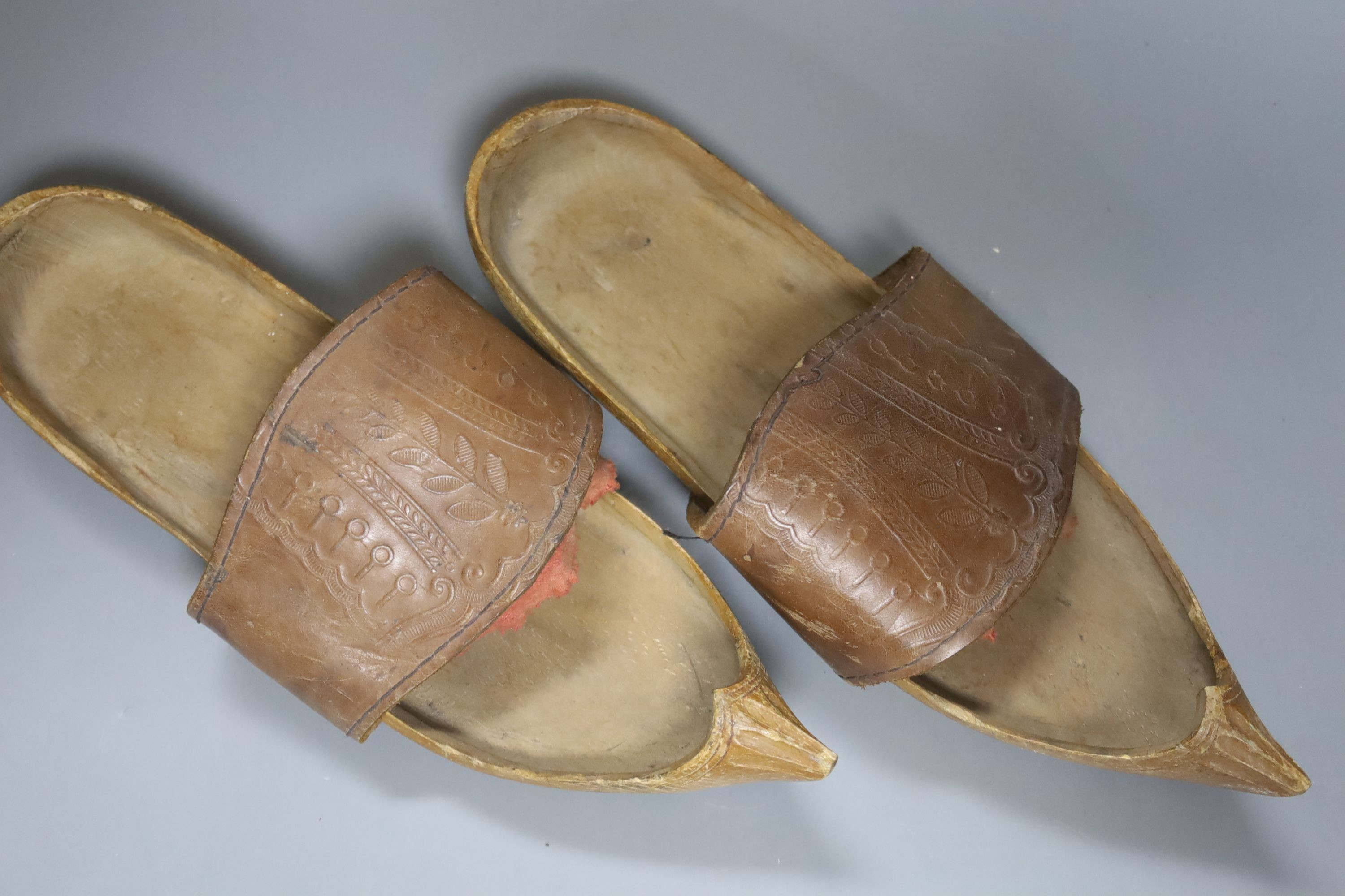 A pair of Eastern carved shoes 28cm